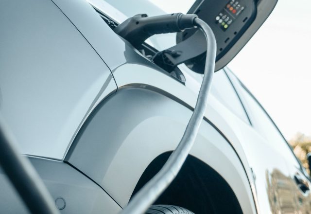 EV charging connector plugged into an electric vehicle charge port